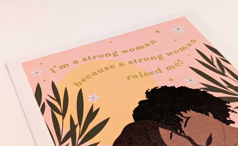 Metalic foil embossed text on "I'm a strong woman because a strong woman raised me!" card